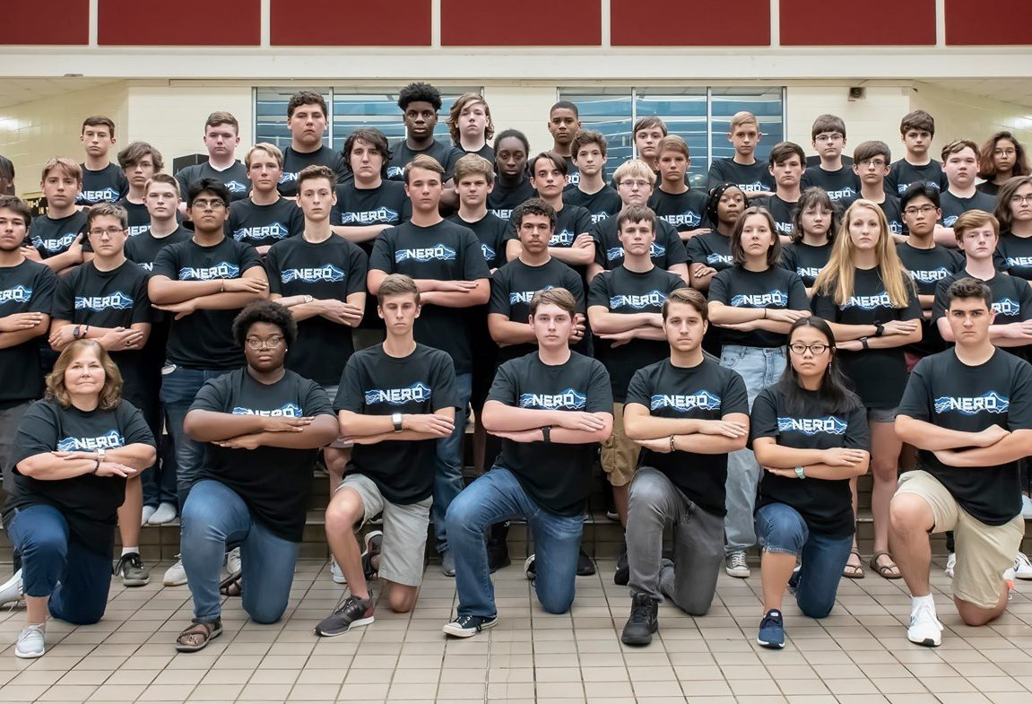 The 2019-2020 WHS STEAM Machine poses for a team picture with their coach, Dr. Virginia Vilardi