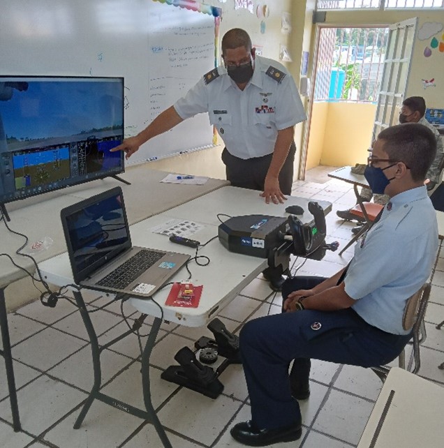 Maj Roman instructs a cadet using the Flight Simulator STEM kit