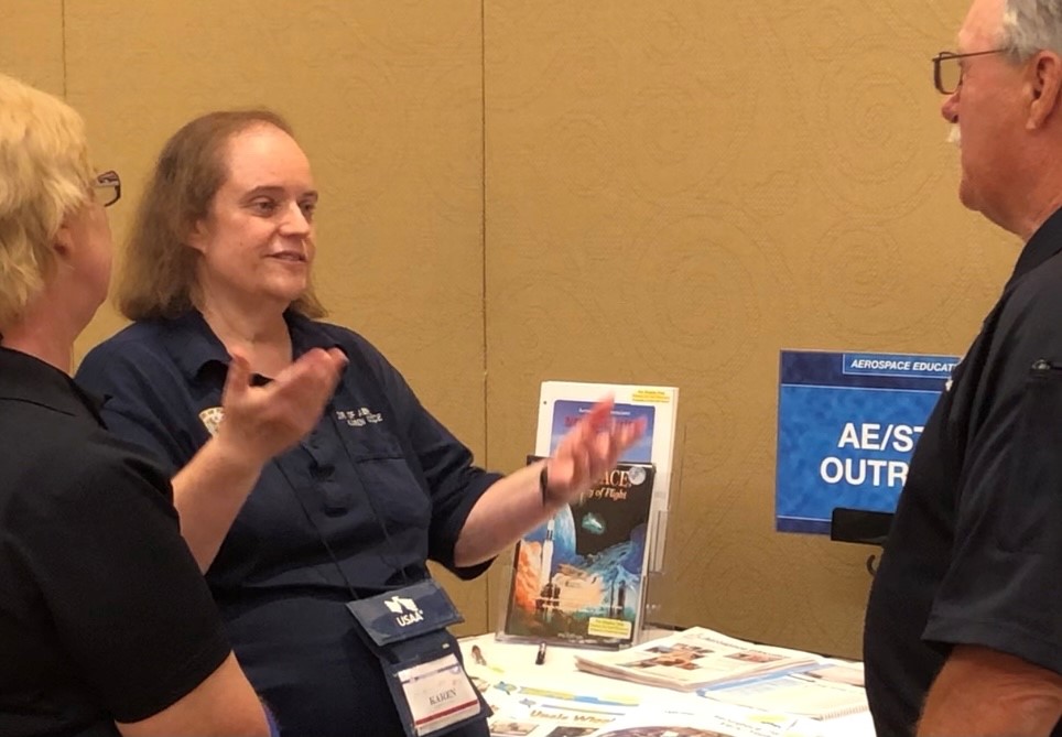 Lt. Col. Karen Cooper discusses AE at the CAP national conference with two members