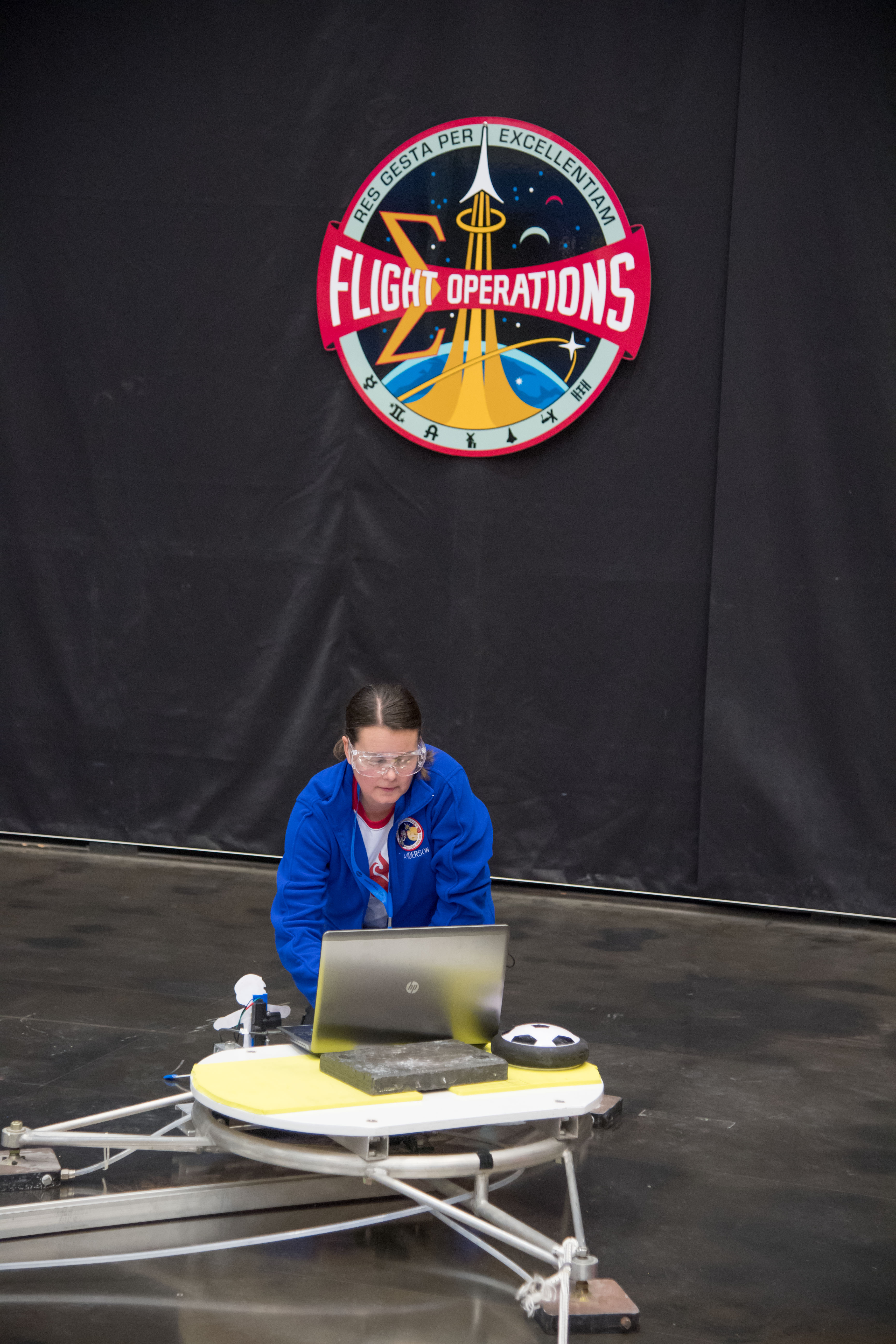 Tanya Anderson demonstrates her students' launch pad at NASA Microgravity Education event.