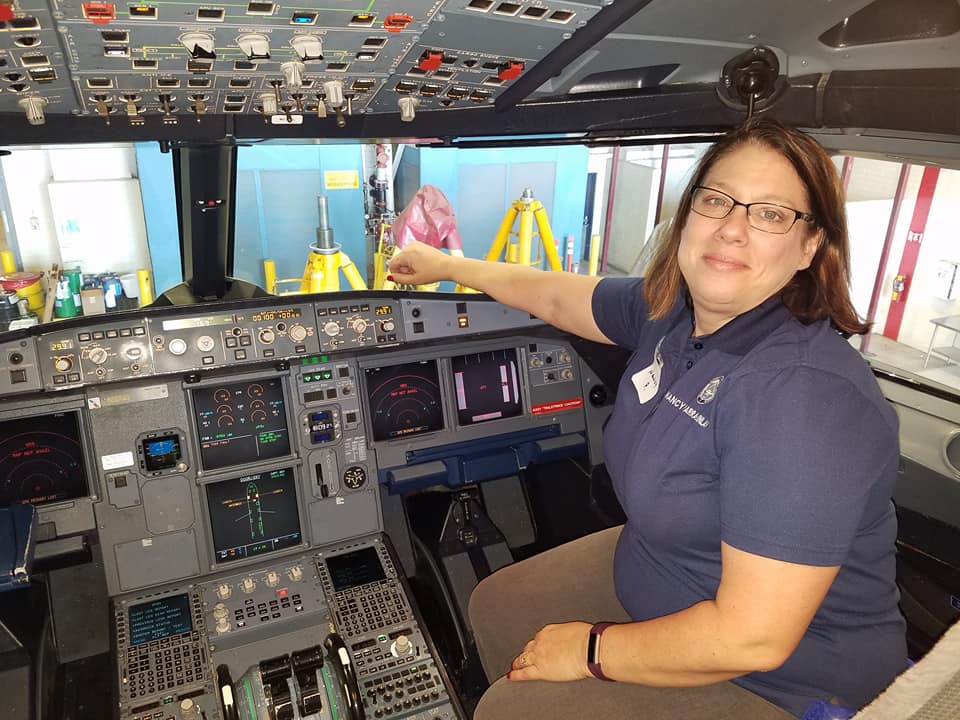 Capt. Parra-Quinlan poses in the cockpit of a plane