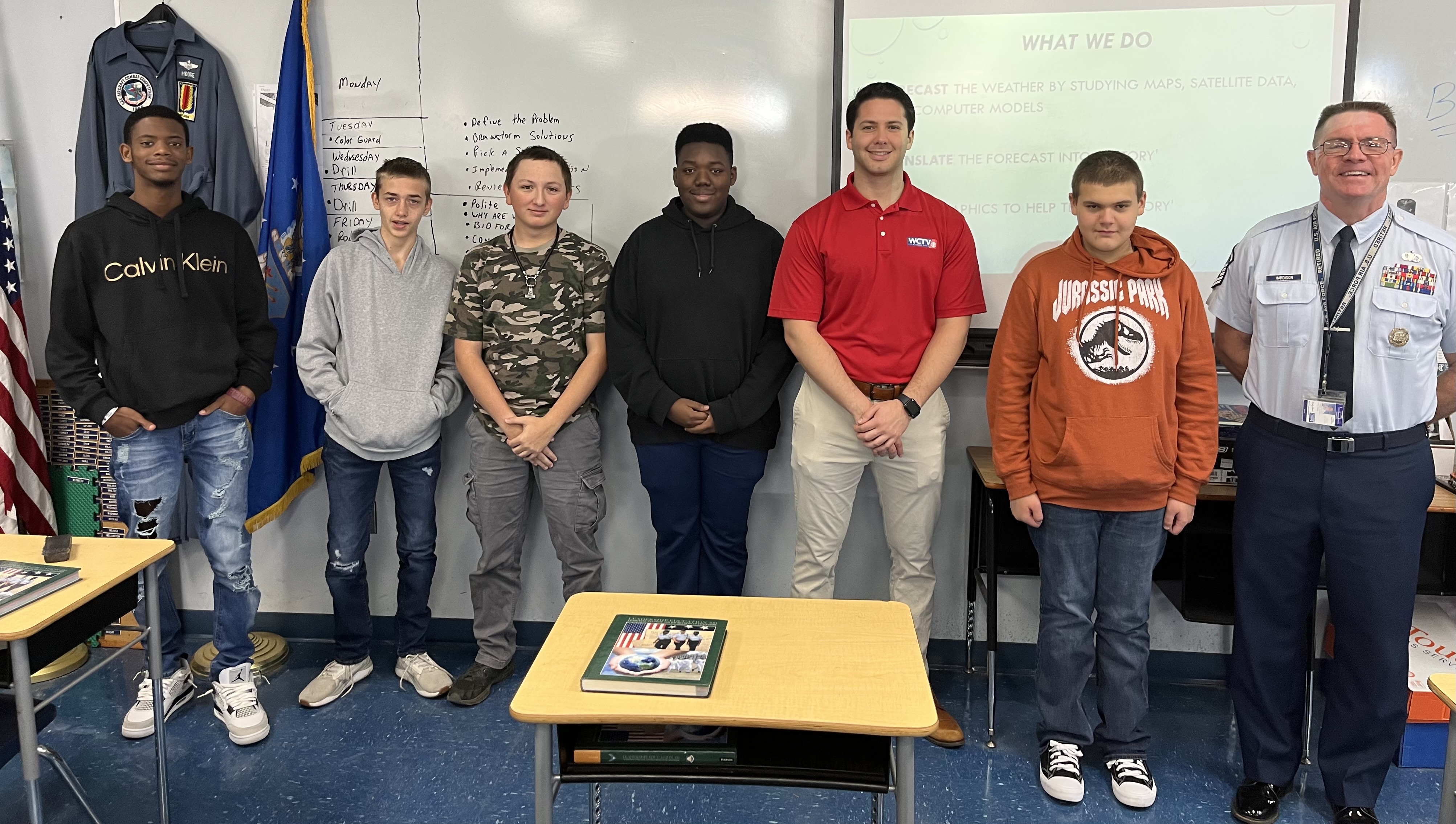 Students and Sgt. Hardison pose with meteorologist
