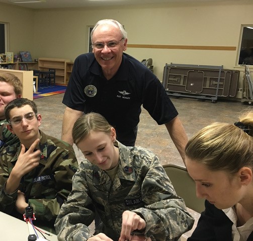 Captain Healey with cadets working on STEM
